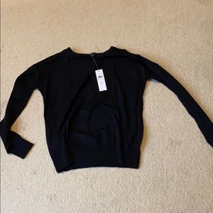 Woman’s sweater with cold shoulders